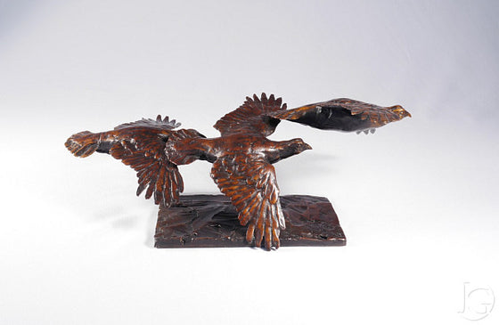 Three Grouse in Flight
