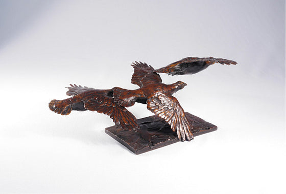 Three Grouse in Flight
